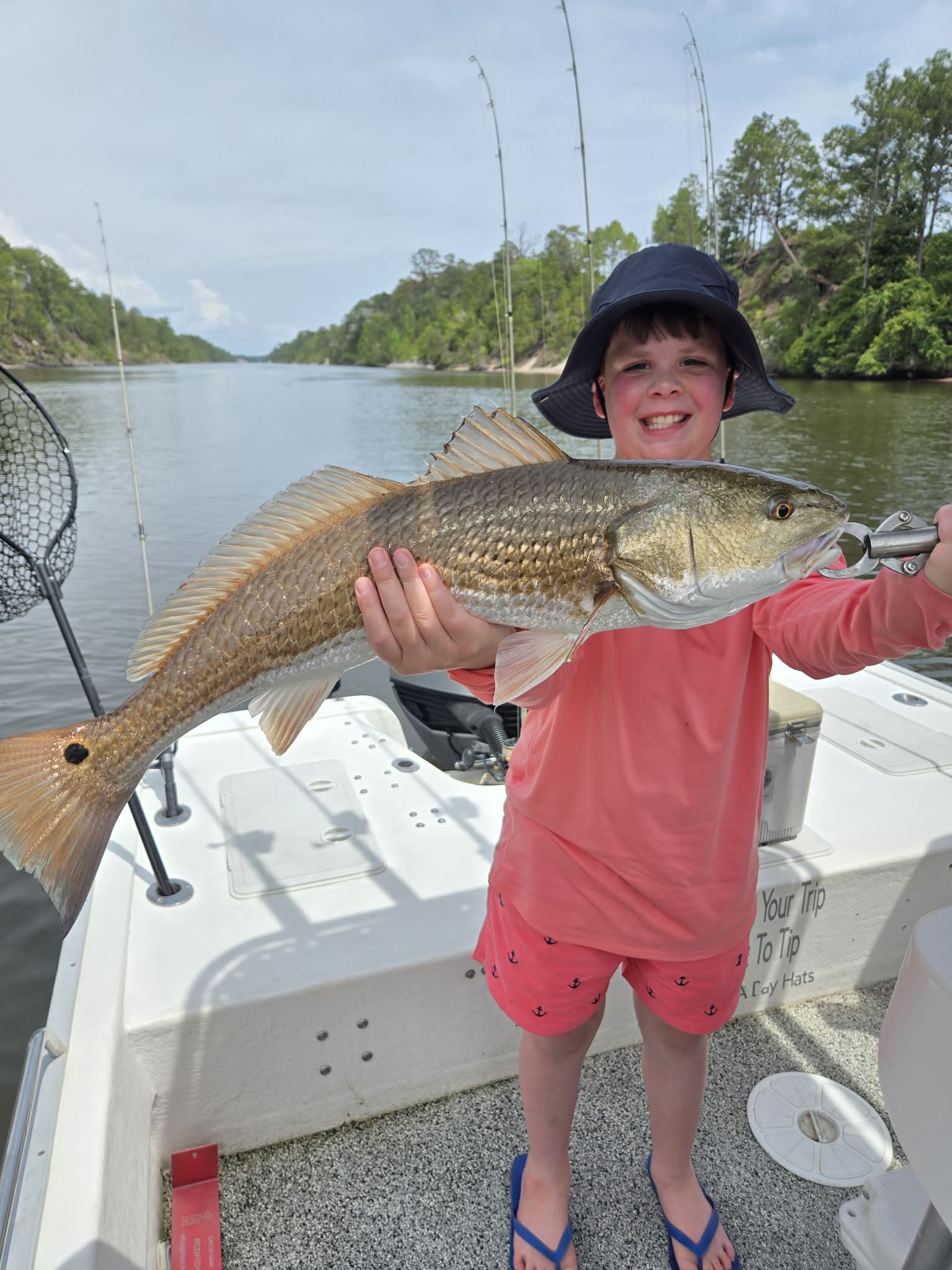 Young angler enjoying a private 30A fishing trip