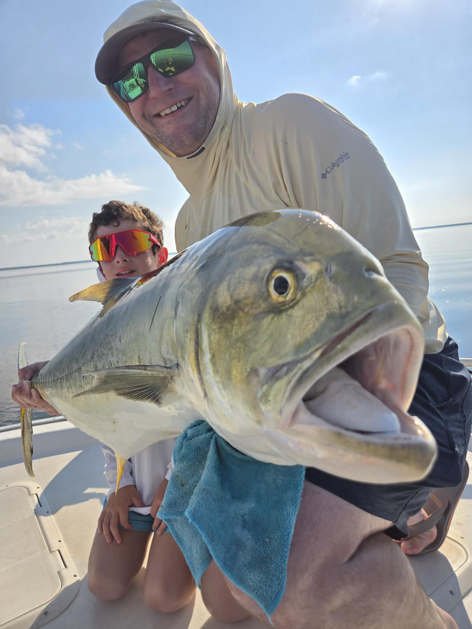 Family celebrating a catch on a private 30A fishing charter